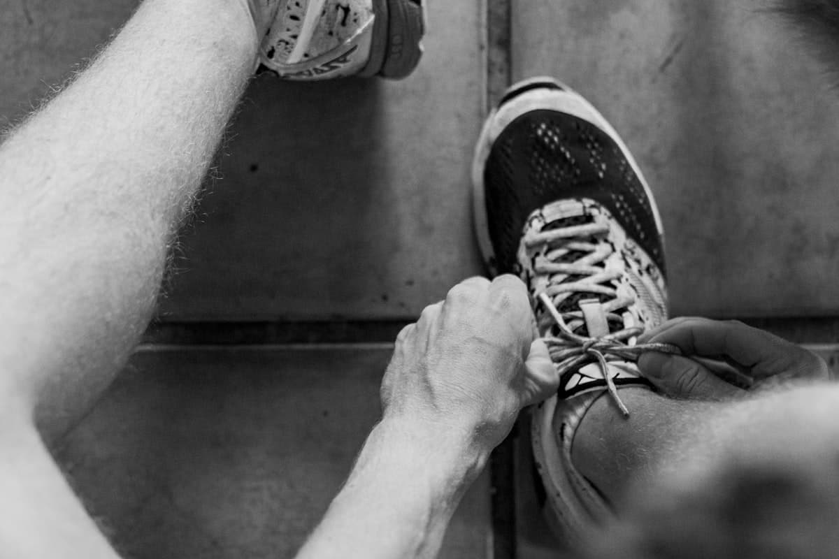 Beginner lifter in a welcoming gym environment with dumbbells
