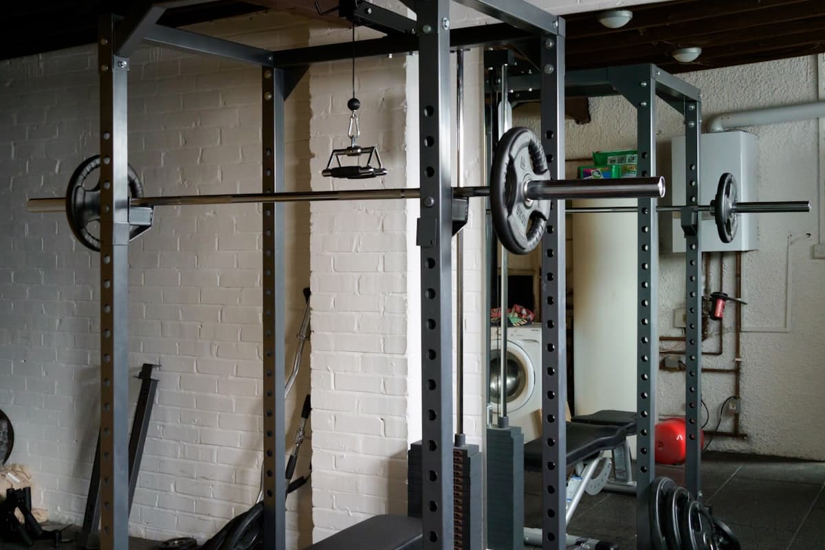 Home garage gym setup with power rack and barbell