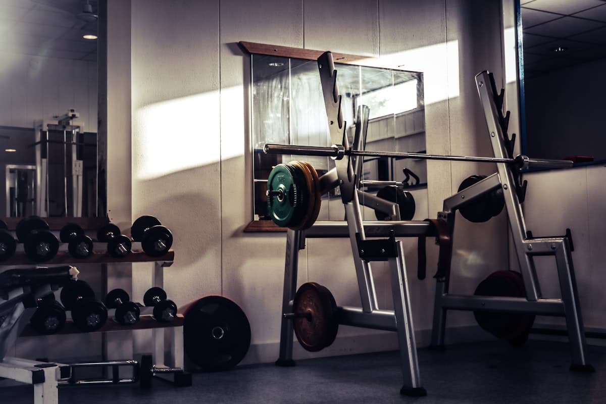 Lifter performing a heavy barbell squat with plates loaded