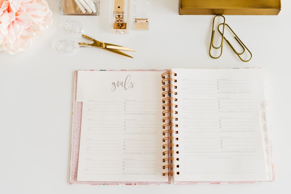 Planner and journal open side by side on an organized desk