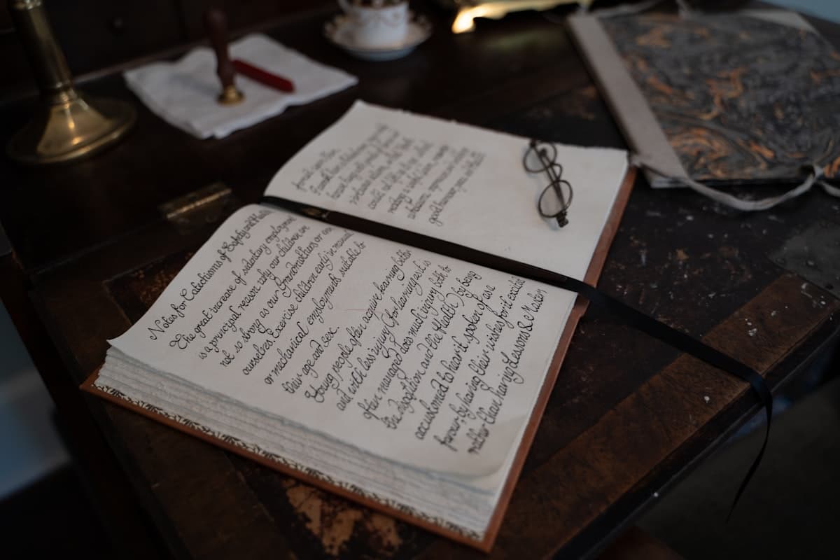 Open notebooks on a wooden table showing handwritten training notes