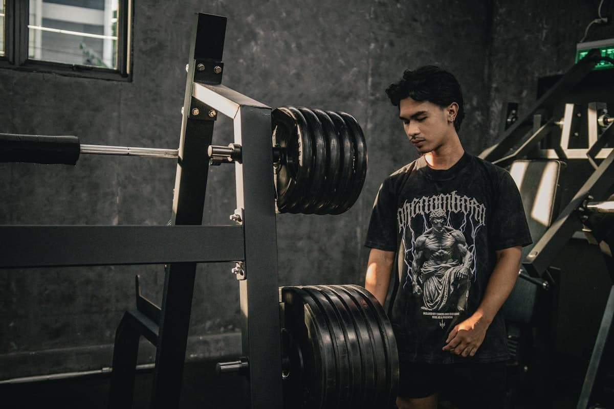 Heavy barbell squat in a power rack gym setting