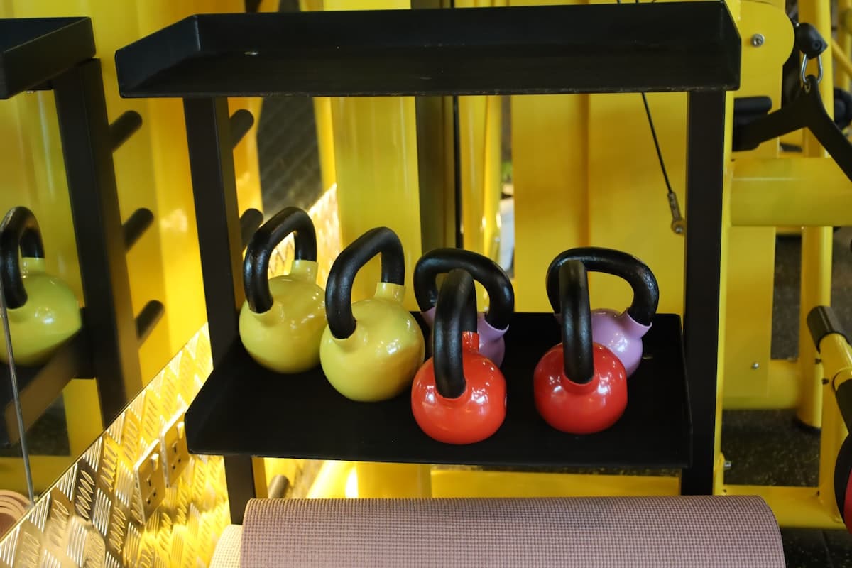 Athlete performing dumbbell rows in a well-equipped gym