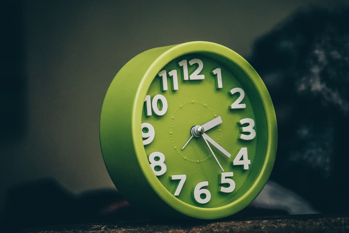 Timer and stopwatch near gym equipment during a rest between sets
