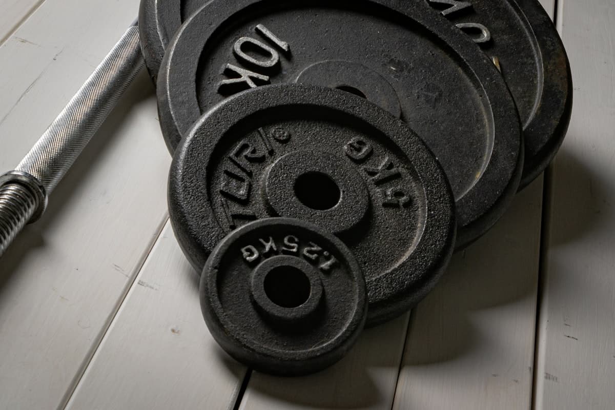 Heavy barbell loaded with competition-level weight in a gym
