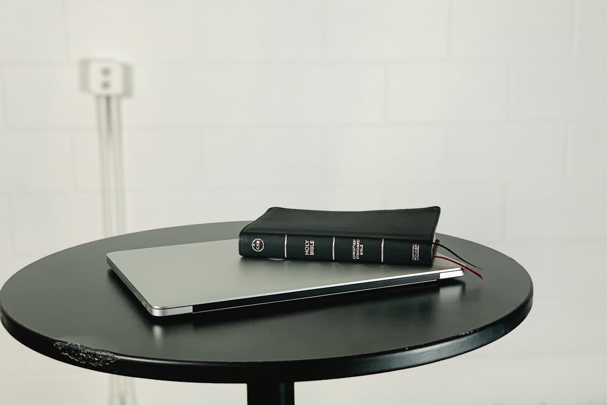 Phone and notebook side by side on a gym bench
