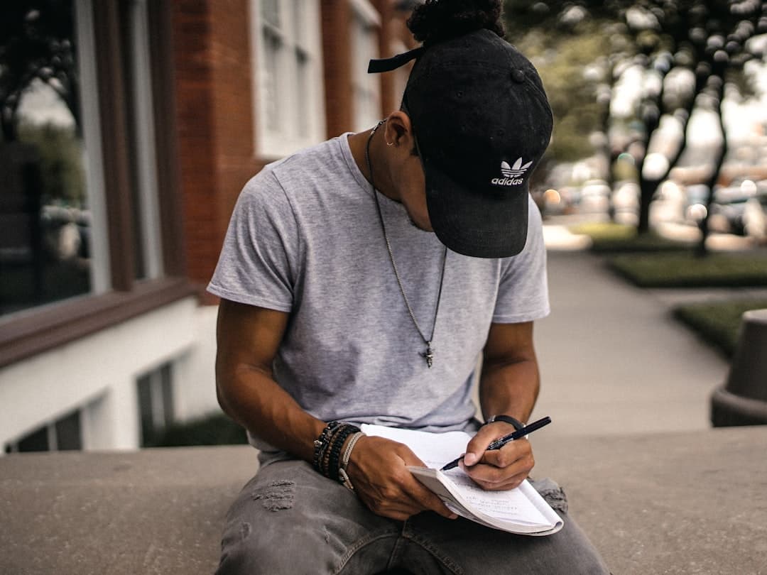 A ForgeLogbooks custom workout journal open on a gym bench